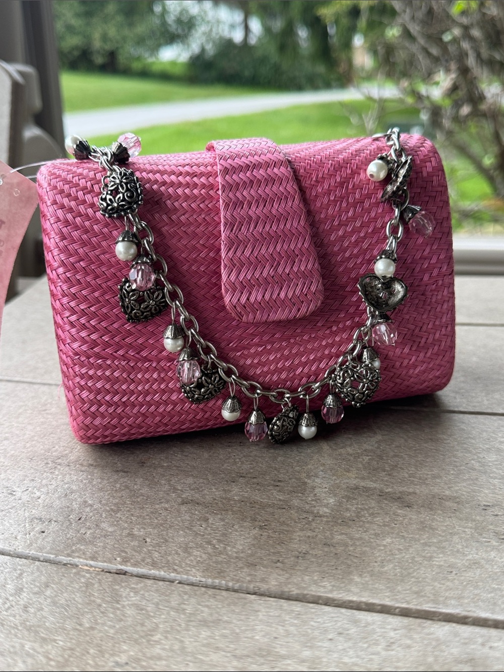Pink Woven Clutch Bag with Decorative Charm Chain by Donna Dixon